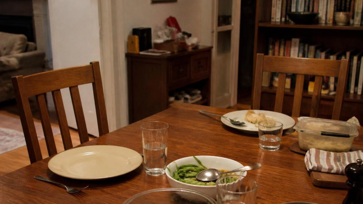 An empty chair at a set table, representing ambiguous loss and grief for someone who is still living, Bergen County NJ