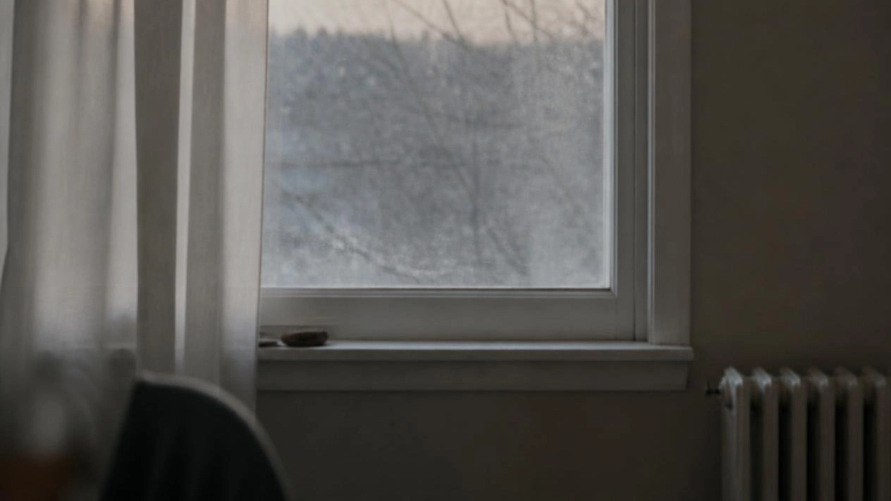 A window in late winter light, representing the second year of grief and long-term grief support in Bergen County, NJ