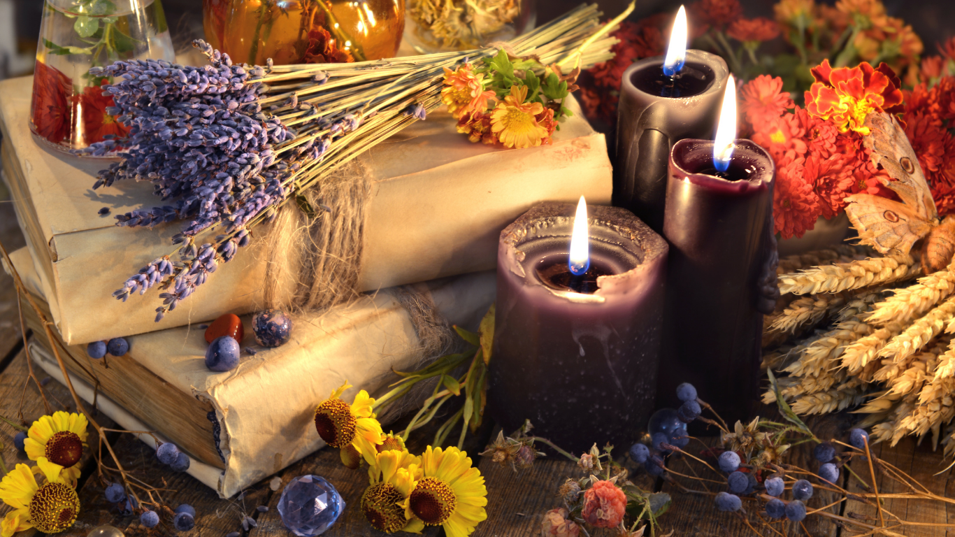 A small personal ritual — a lit candle and meaningful objects — honoring an unrecognized disenfranchised loss